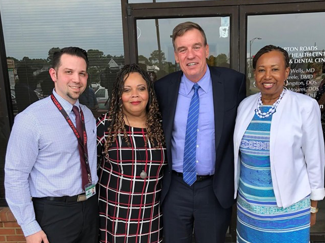 Group photo of Hampton Roads staff and Senator Mark Warner