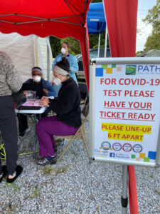 PATHS staff registering someone for testing at the COVID-19 mobile event