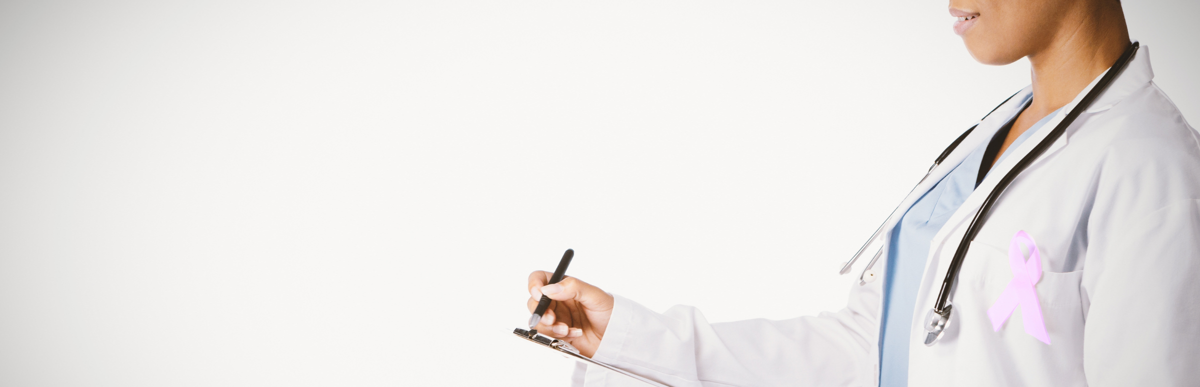 Side profile of a doctor holding a clipboard with a cancer ribbon.