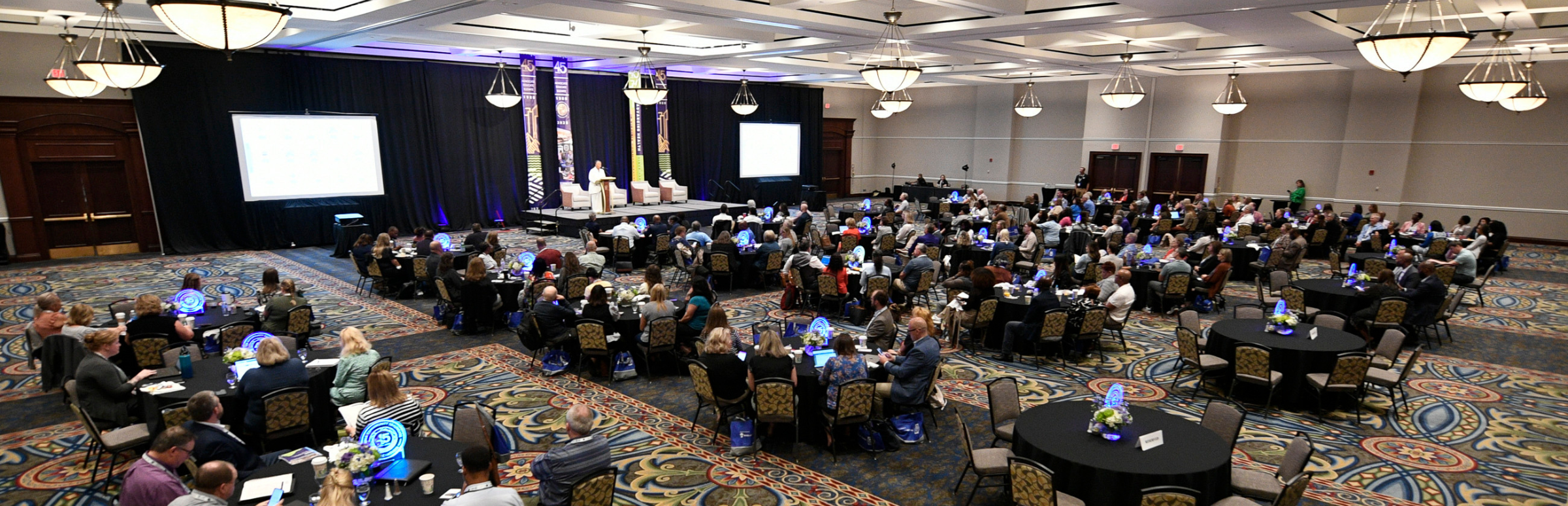 Aerial photo of ballroom full of round tables at 2025 VCHA Annual Conference