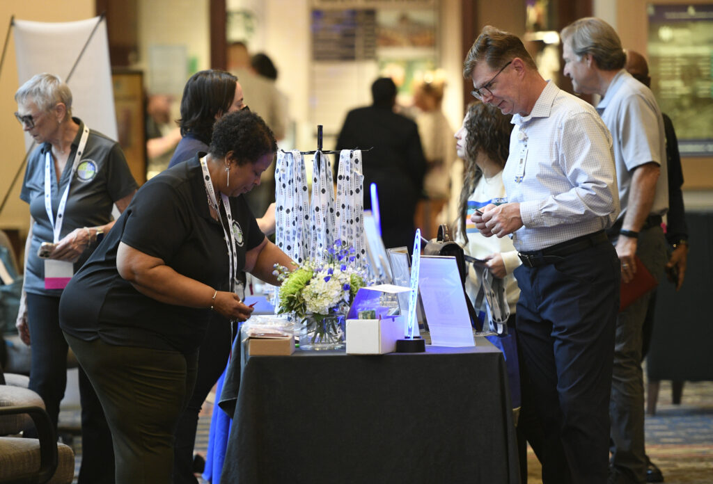 Individuals check in at registration at VCHA's Annual Conference