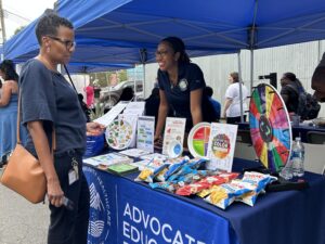 Adrienne tabling at a community event.