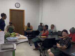 Adrienne leading a cooking workshop for seniors.