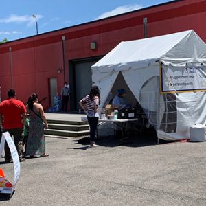 Neighborhood Health Registration tent and testing area for community COVID-19 testing event