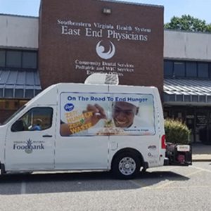 Exterior of East End Physicians building with the foodbank truck parked in front of the building
